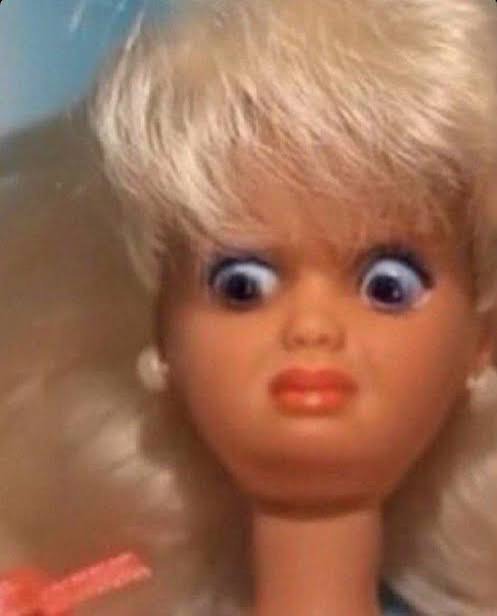 The ICK face — a blonde doll staring at the camera with wide eyes and a look of pure disgust